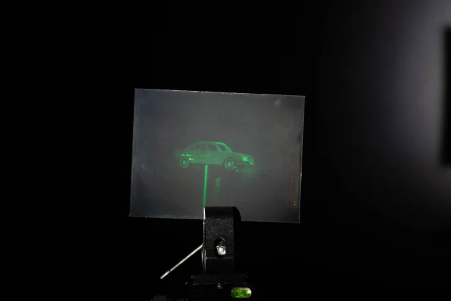 White light hologram of a model car from different viewing angles