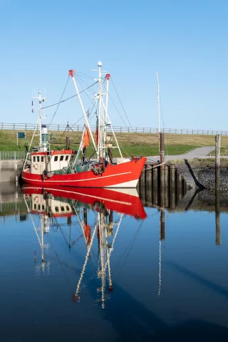Red fishing boat in the southern harbor