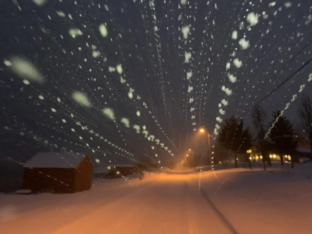 Snowflakes in the light of the headlamp