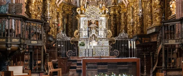 The high altar with the seated figure of St. James under a gilded canopy
