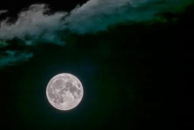 The full moon with clouds on 08/30/2023